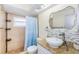 Neutral bathroom features granite countertops, shower, and stone mosaic tile at 7420 Cay Dr, Port Richey, FL 34668