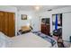 Standard bedroom with a desk, closet, and neutral color palette at 7420 Cay Dr, Port Richey, FL 34668