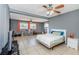 Spacious bedroom with neutral paint, tile floors, and natural lighting at 7420 Cay Dr, Port Richey, FL 34668
