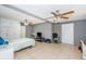 Spacious bedroom with neutral paint, tile floors, and natural lighting at 7420 Cay Dr, Port Richey, FL 34668