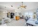 Bright dining area boasts lots of natural light, ceramic tile floors, and a ceiling fan at 7420 Cay Dr, Port Richey, FL 34668