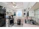 Efficient kitchen with sleek black appliances, stylish pink countertops, and ample cabinet space at 7420 Cay Dr, Port Richey, FL 34668