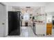 Functional kitchen with appliances, white cabinets, and bright countertops at 7420 Cay Dr, Port Richey, FL 34668