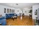 Open living area showcasing hardwood floors, comfortable furniture, and stylish décor at 7420 Cay Dr, Port Richey, FL 34668