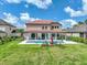 Stunning backyard featuring a sparkling pool and spacious patio, perfect for outdoor entertaining at 7927 Hampton Lake Dr, Tampa, FL 33647