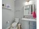 Powder room featuring neutral colors and a modern mirror at 7927 Hampton Lake Dr, Tampa, FL 33647
