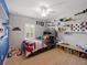 bedroom with carpet, ceiling fan, shelving, and playful decor at 7927 Hampton Lake Dr, Tampa, FL 33647