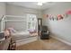 Bedroom with carpet, gray chair, decorative mirror, and a window with shutters at 7927 Hampton Lake Dr, Tampa, FL 33647