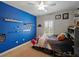 bedroom with carpet, ceiling fan, shelving, and a window with shutters at 7927 Hampton Lake Dr, Tampa, FL 33647