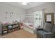 Bedroom with carpet, gray chair, decorative mirror, and shelving at 7927 Hampton Lake Dr, Tampa, FL 33647