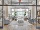 Grand Hampton clubhouse entry featuring coffered ceiling, elegant lighting, and comfortable seating at 7927 Hampton Lake Dr, Tampa, FL 33647