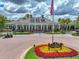 Grand Hampton Clubhouse featuring beautiful landscaping and a welcoming entrance at 7927 Hampton Lake Dr, Tampa, FL 33647