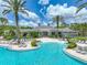 Grand Hampton community pool featuring a lagoon style pool with lounge chairs at 7927 Hampton Lake Dr, Tampa, FL 33647