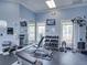 Well-equipped fitness center with free weights, weight machines, mirrors, and televisions at 7927 Hampton Lake Dr, Tampa, FL 33647
