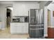 Well-equipped kitchen with stainless steel appliances, granite counters, and ample cabinet space at 7927 Hampton Lake Dr, Tampa, FL 33647
