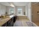 Beautiful bathroom featuring double sinks, a soaking tub, a shower, and tile flooring at 7927 Hampton Lake Dr, Tampa, FL 33647