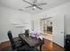 Home office with ceiling fan and hardwood floors leading to other parts of the house at 7927 Hampton Lake Dr, Tampa, FL 33647