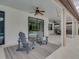 Covered patio with ceiling fans and view of the pool at 7927 Hampton Lake Dr, Tampa, FL 33647