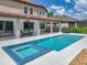 Beautiful backyard featuring a pool, spa, and covered patio, great for outdoor living at 7927 Hampton Lake Dr, Tampa, FL 33647