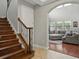 Staircase leading to a sunlit living room area at 7927 Hampton Lake Dr, Tampa, FL 33647
