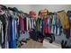 Organized walk-in closet providing plenty of storage space for clothing, shoes, and accessories at 7927 Hampton Lake Dr, Tampa, FL 33647