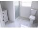 A clean bathroom features a toilet, vanity and glass shower at 8817 Audrey Ln, Tampa, FL 33615