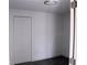 An empty bedroom has a closet and gray flooring at 8817 Audrey Ln, Tampa, FL 33615