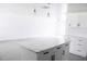 Bright, open kitchen with white cabinets, sleek countertops, and an island, perfect for cooking and entertaining at 8817 Audrey Ln, Tampa, FL 33615