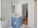 Stylish bathroom vanity with marble countertop and gold fixtures provides a modern touch at 9653 Golden Grove St, Seminole, FL 33772