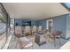 Outdoor patio features comfortable seating, a fire pit, and a full bar, creating a cozy and inviting atmosphere at 9653 Golden Grove St, Seminole, FL 33772