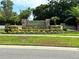Attractive brick entrance sign for the Sunstream community surrounded by lush greenery at 2867 Sunstream Ln, Clearwater, FL 33759
