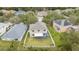 Backyard aerial view featuring a screened-in lanai and fenced yard at 10525 Lucaya Dr, Tampa, FL 33647