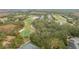 An aerial view of a neighborhood with a golf course and ponds at 10525 Lucaya Dr, Tampa, FL 33647