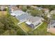 Aerial view showcasing the backyard, screened-in lanai, and white picket fence at 10525 Lucaya Dr, Tampa, FL 33647