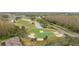 Picturesque aerial view of a well-maintained golf course with a lake and manicured landscaping at 10525 Lucaya Dr, Tampa, FL 33647