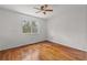 Bedroom featuring gleaming hardwood floors and lots of natural light at 10525 Lucaya Dr, Tampa, FL 33647