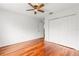 This bedroom features gleaming hardwood floors and a spacious closet at 10525 Lucaya Dr, Tampa, FL 33647