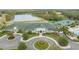 Aerial view of the community center, pool, tennis courts, and lush landscaping at 10525 Lucaya Dr, Tampa, FL 33647