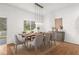 Elegant dining area featuring modern lighting, stylish furniture, and a serene view, perfect for entertaining guests at 10525 Lucaya Dr, Tampa, FL 33647