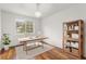 Bright home office features wood floors, neutral walls, a large window, and contemporary furnishings at 10525 Lucaya Dr, Tampa, FL 33647