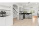 Bright kitchen with white cabinets, stainless steel appliances, and granite counters at 10525 Lucaya Dr, Tampa, FL 33647
