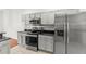 Modern kitchen featuring stainless steel appliances and grey cabinets at 10525 Lucaya Dr, Tampa, FL 33647