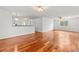 A spacious living room features glossy wood floors, white walls, and natural light at 10525 Lucaya Dr, Tampa, FL 33647