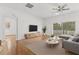 Bright living room with hardwood floors, modern furniture, and natural light at 10525 Lucaya Dr, Tampa, FL 33647