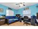 Bedroom featuring two-tone walls, ceiling fan, closet, and wood-look flooring at 10907 Kewanee Dr, Temple Terrace, FL 33617