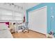 Bedroom featuring light walls, ceiling fan, closet, and wood-look flooring at 10907 Kewanee Dr, Temple Terrace, FL 33617