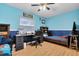 Bedroom featuring two-tone walls, ceiling fan, closet, and wood-look flooring at 10907 Kewanee Dr, Temple Terrace, FL 33617