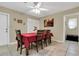 Bright dining room featuring tiled floors and classic wood table set with seating for six at 10907 Kewanee Dr, Temple Terrace, FL 33617