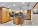 Spacious kitchen with stainless steel appliances, breakfast bar, and granite countertops at 10907 Kewanee Dr, Temple Terrace, FL 33617