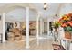 Open-concept living room featuring neutral tones, ample natural light, and arched entryways at 10907 Kewanee Dr, Temple Terrace, FL 33617